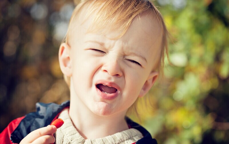 child with sour face