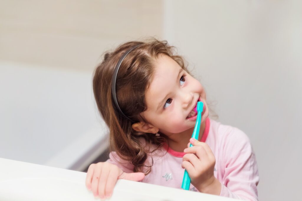 Girl brushing teeth