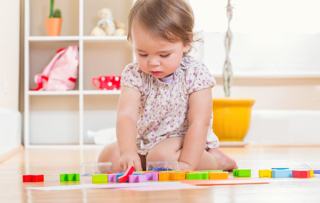 toddler playing with blocks