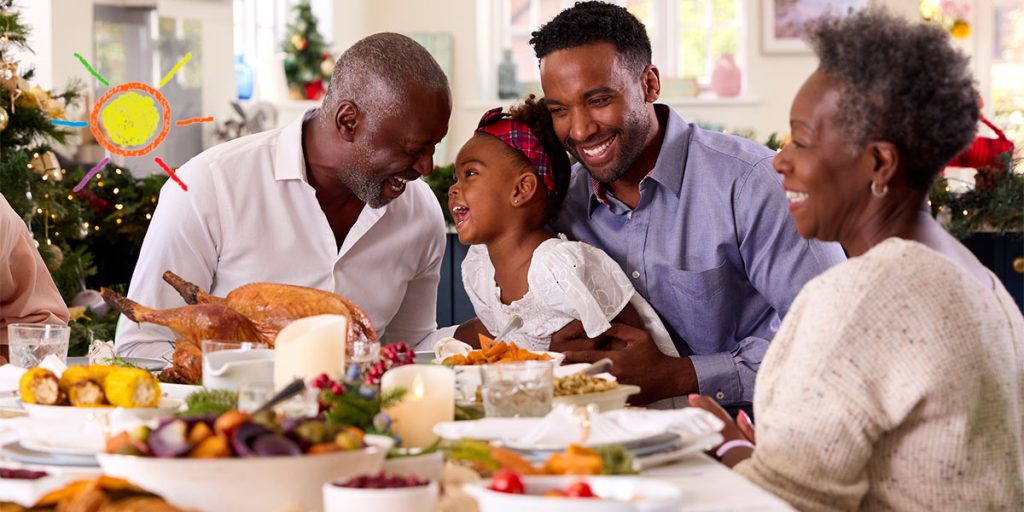 Happy family eating dinner on Thanksgiving