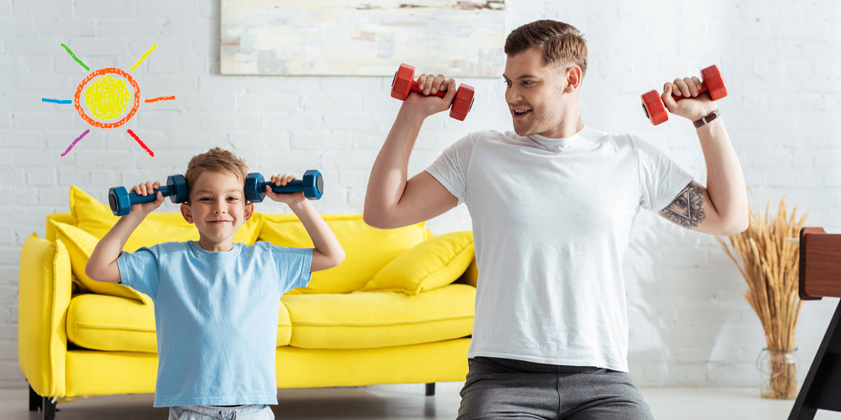 Child exercising with weights with an adult