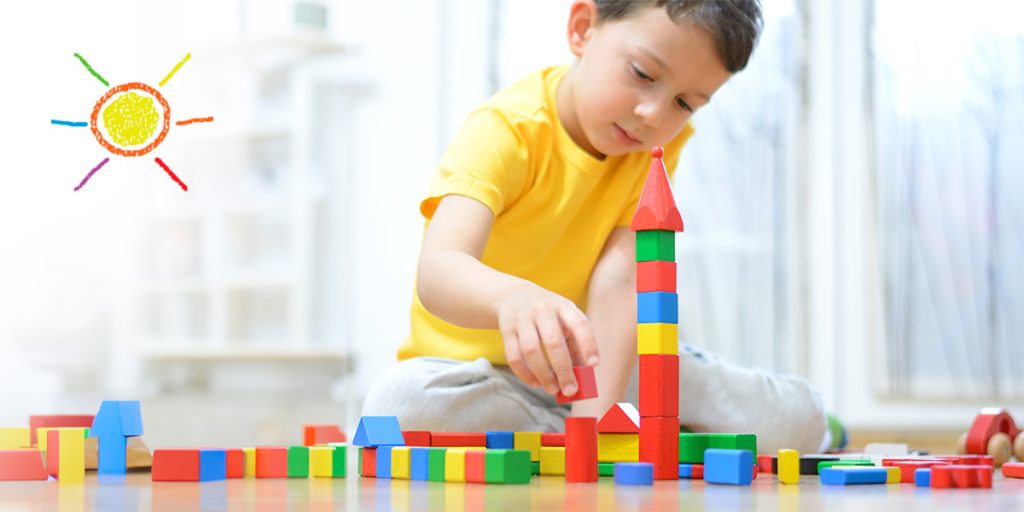 Child playing with building blocks
