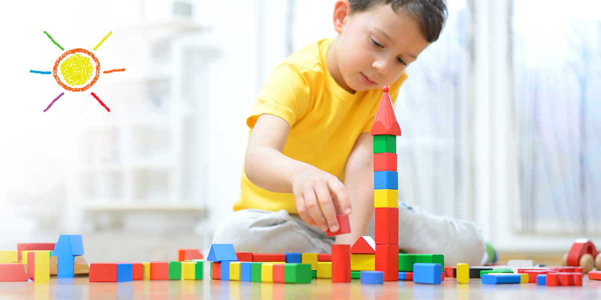 Child playing with building blocks