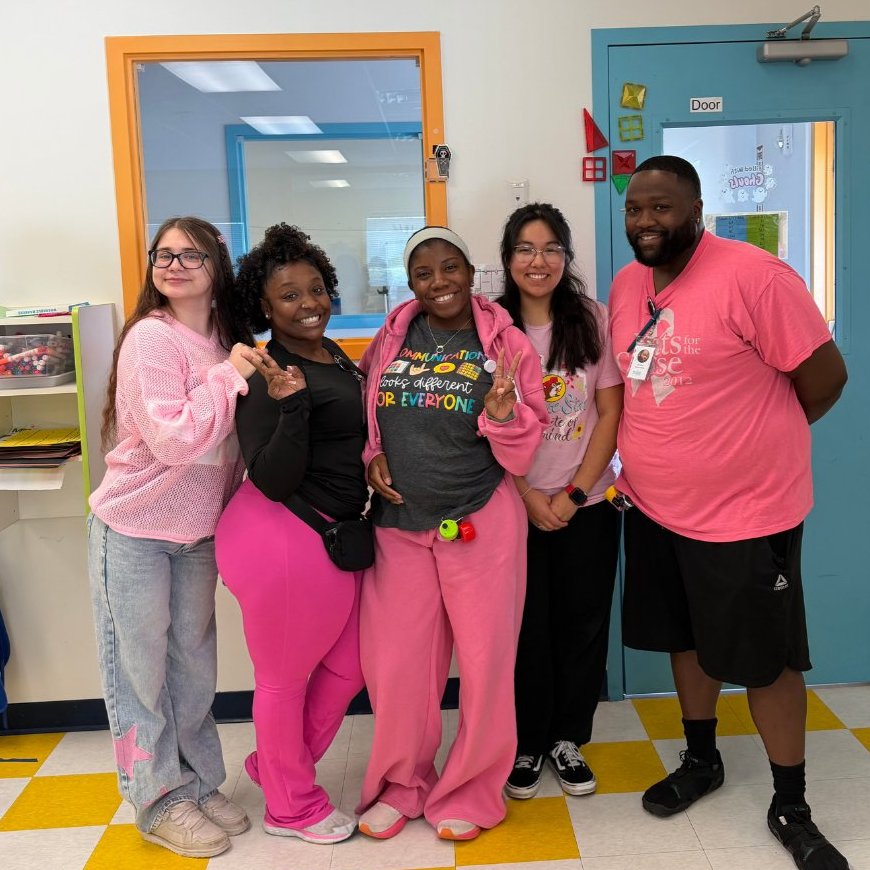 Spectrum of Hope team members smiling together inside one of our centers